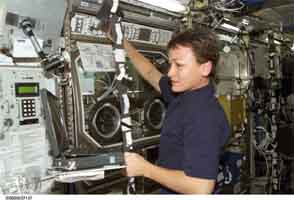 Glovebox and Astronaut on Space Station